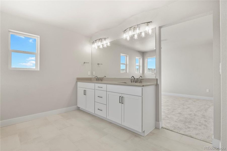 Five-piece bath finished with quartz counters and dual vanity