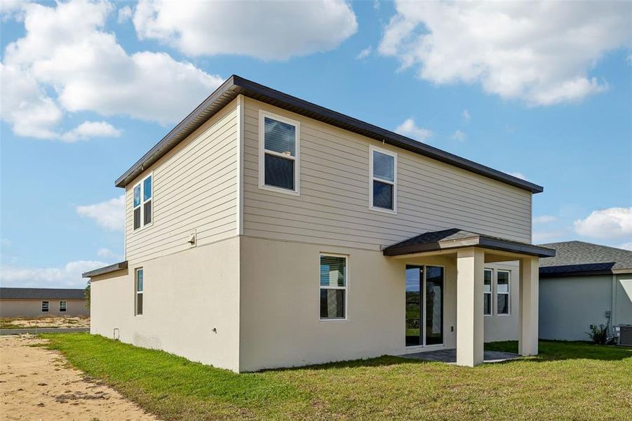 Exterior details and patio area of a home in Crosswinds - Signature Series, Haines City (Image 4).