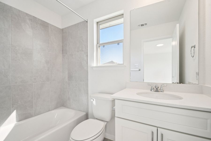 Furnished interior view inside a new home in Crosswinds, Kyle (Image 9).