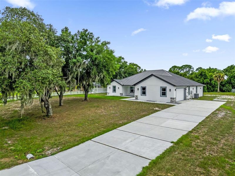Front exterior of a new home in , Lake Wales, FL, highlighting curb appeal (Image 2). Front exterior of a new home in , Lake Wales, FL, highlighting curb appeal (Image 2).