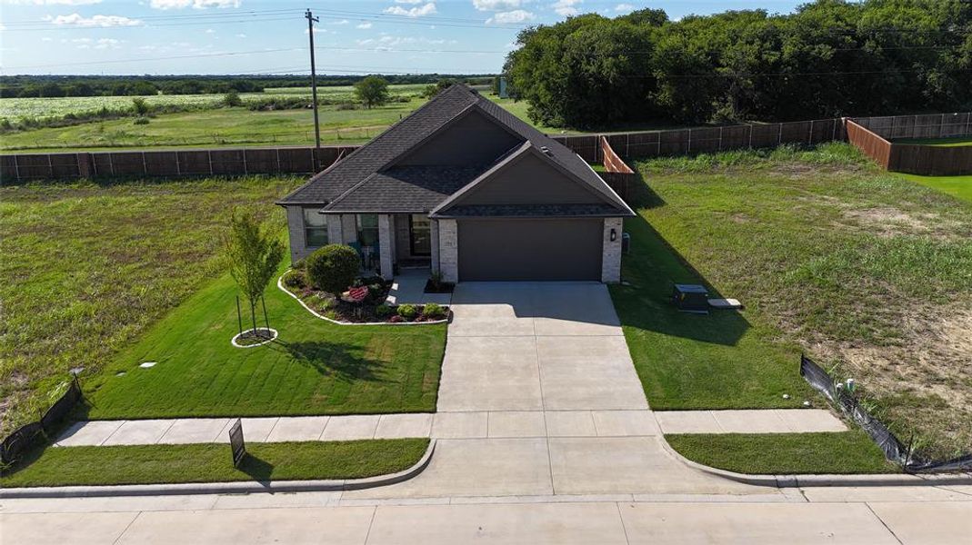 Front exterior of a new home in , Venus, TX, highlighting curb appeal (Image 22). Front exterior of a new home in , Venus, TX, highlighting curb appeal (Image 22).