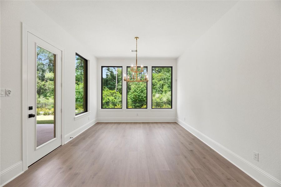 Enjoy your meals in this light-filled dining area, where expansive picture windows showcase the beautiful views.