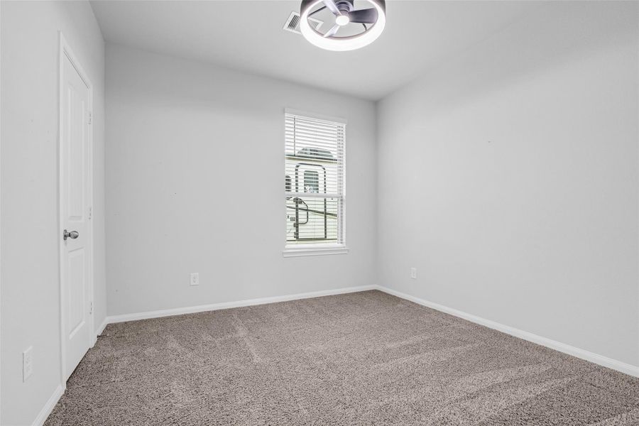 Spacious bedroom with closets facing east.