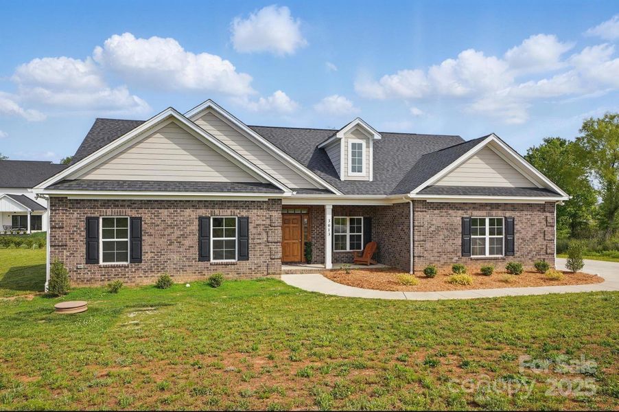 Front exterior of a new home in , Monroe, NC, highlighting curb appeal (Image 1).