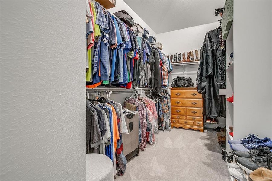 Large walk in closet with shelving