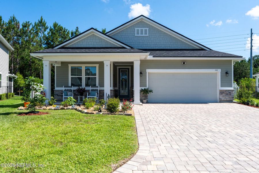 Front exterior of a new home in Elm Creek at Silverleaf, St. Augustine, FL, highlighting curb appeal (Image 2). Front exterior of a new home in Elm Creek at Silverleaf, St. Augustine, FL, highlighting curb appeal (Image 2).