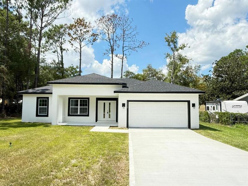 Front exterior of a new home in , Citrus Springs, FL, highlighting curb appeal (Image 23). Front exterior of a new home in , Citrus Springs, FL, highlighting curb appeal (Image 23).