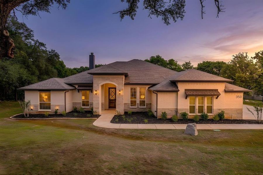 Front exterior of a new home in , Poolville, TX, highlighting curb appeal (Image 1). Front exterior of a new home in , Poolville, TX, highlighting curb appeal (Image 1).