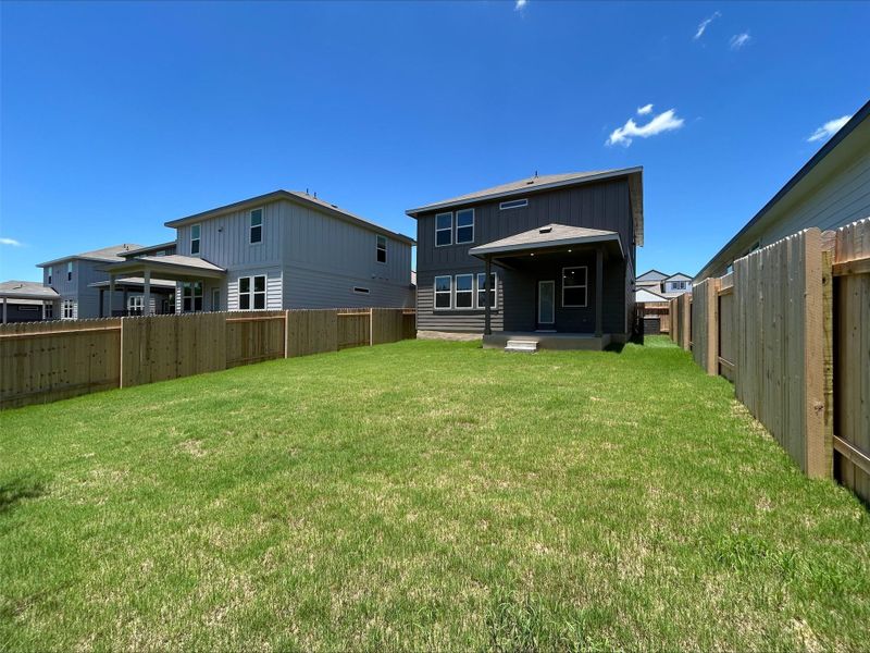 Back of property featuring a fenced backyard Back of property featuring a fenced backyard