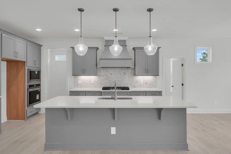 Representative furnished interior of a home built from the The Hampton by RobuckHomes in Windwater, Hampstead (Image 19).