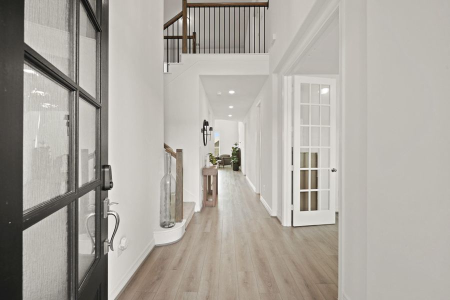 A gorgeous, two-story extended foyer greets you as you enter the home.