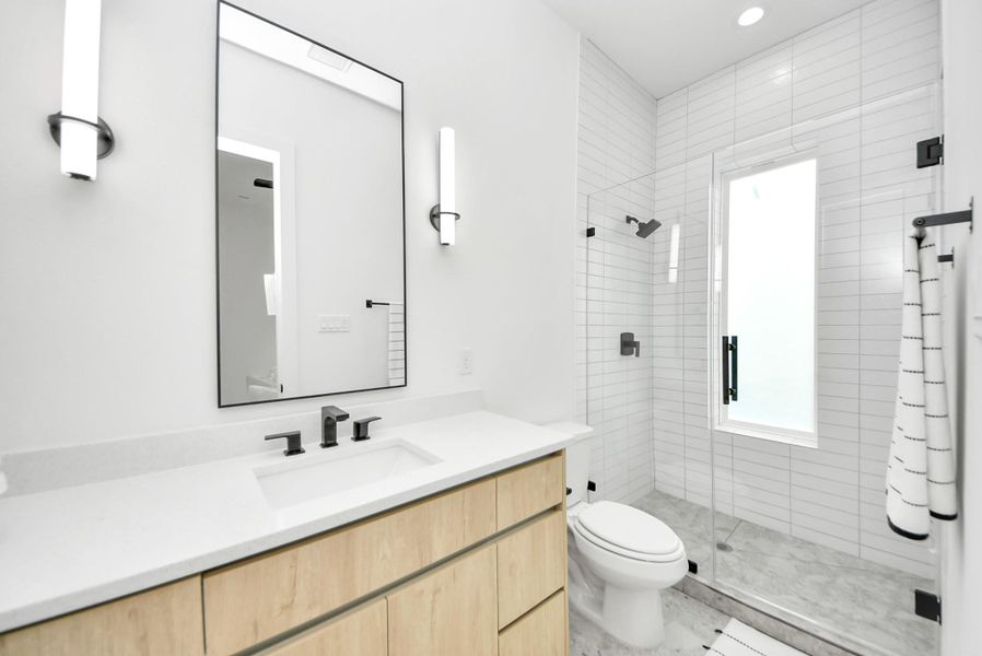 Full bathroom located off the home office.