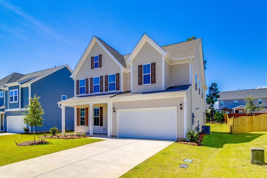 Front exterior of a new home in Pebble Branch, Chapin, SC, highlighting curb appeal (Image 2). Front exterior of a new home in Pebble Branch, Chapin, SC, highlighting curb appeal (Image 2).
