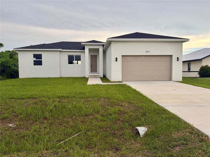 Front exterior of a new home in , Port Charlotte, FL, highlighting curb appeal (Image 2). Front exterior of a new home in , Port Charlotte, FL, highlighting curb appeal (Image 2).