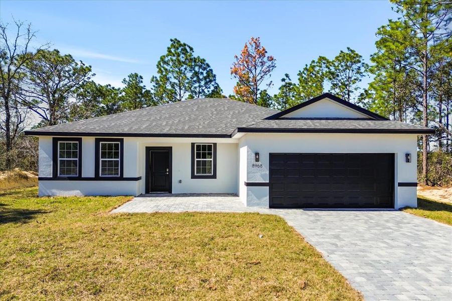 Front exterior of a new home in , Citrus Springs, FL, highlighting curb appeal (Image 18).