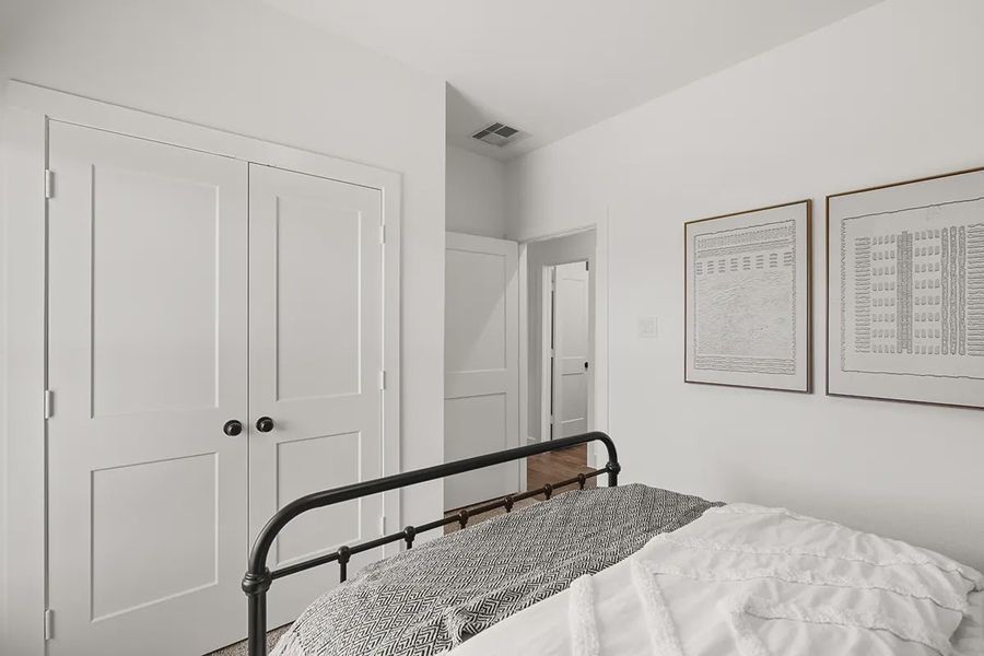 Representative furnished interior of a home built from the Countryside by Chesmar Homes in Meridiana Townhomes, Iowa Colony (Image 18).