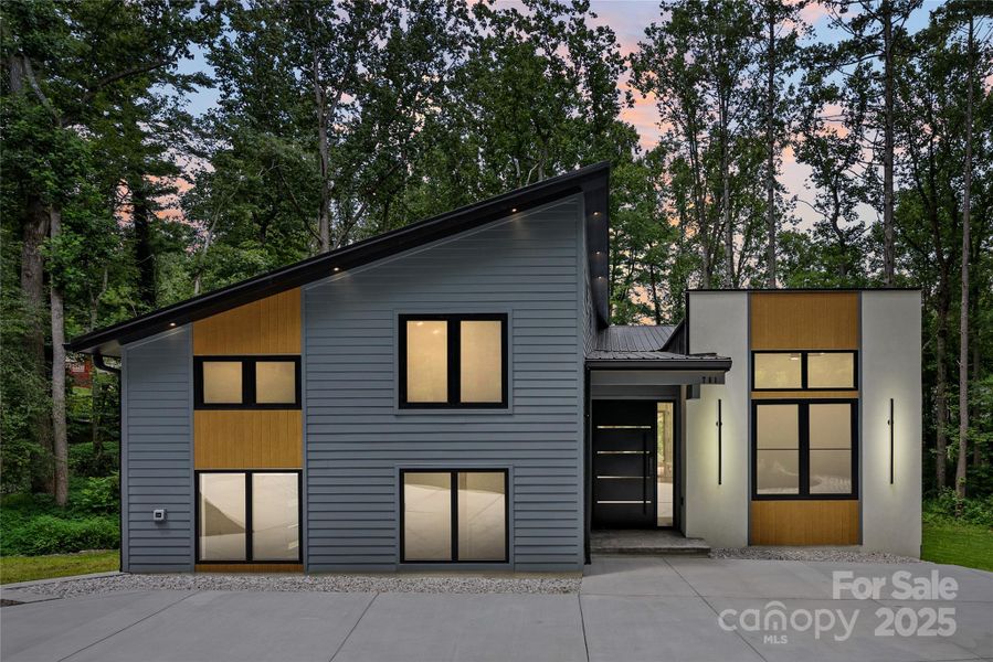 Front exterior of a new home in , Arden, NC, highlighting curb appeal (Image 1).