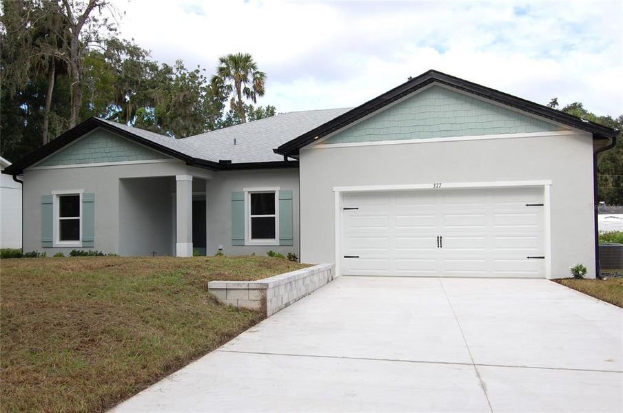 Front exterior of a new home in , New Smyrna Beach, FL, highlighting curb appeal (Image 14). Front exterior of a new home in , New Smyrna Beach, FL, highlighting curb appeal (Image 14).