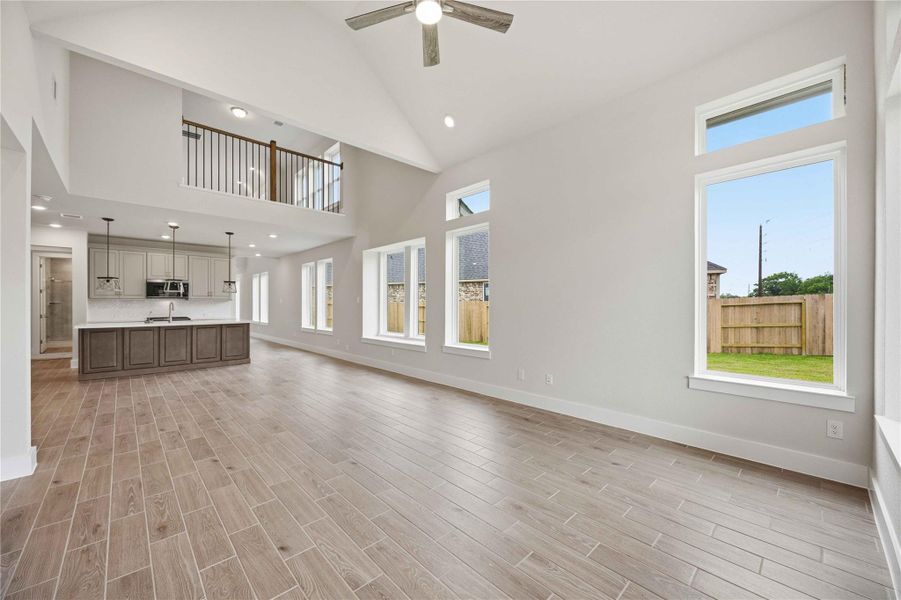 Spacious, unfurnished interior of a new home in Ellwood, Iowa Colony (Image 25).
