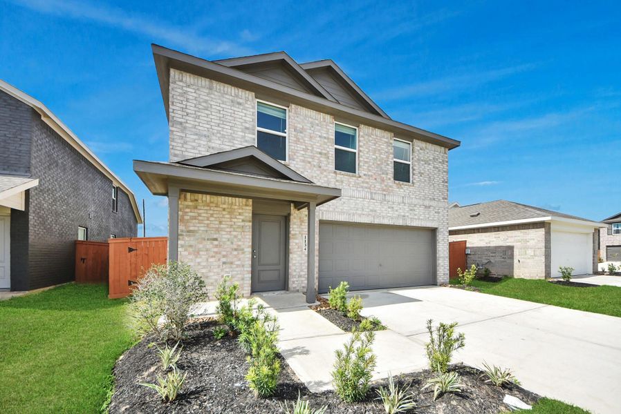 Front exterior of a new home in Emberly, Beasley, TX, highlighting curb appeal (Image 21). Front exterior of a new home in Emberly, Beasley, TX, highlighting curb appeal (Image 21).