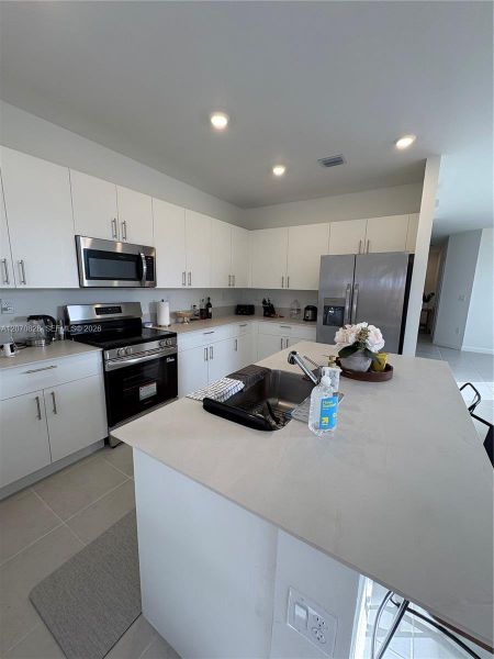 Furnished interior view inside a new home in , Homestead (Image 2). Furnished interior view inside a new home in , Homestead (Image 2).