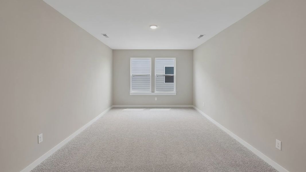 Second Floor Loft area with windows and carpet Second Floor Loft area with windows and carpet