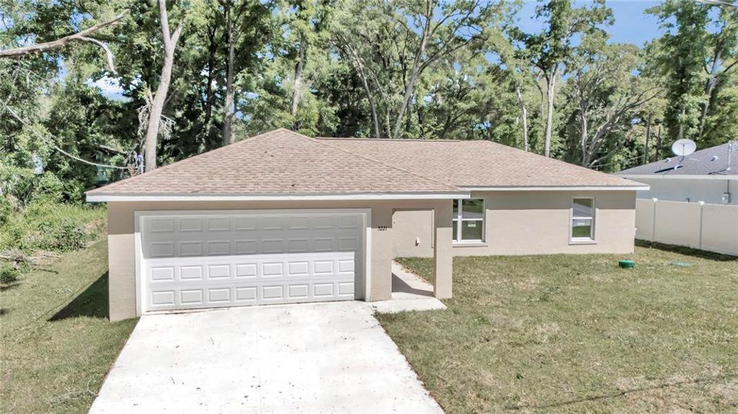 Front exterior of a new home in , Ocala, FL, highlighting curb appeal (Image 1). Front exterior of a new home in , Ocala, FL, highlighting curb appeal (Image 1).