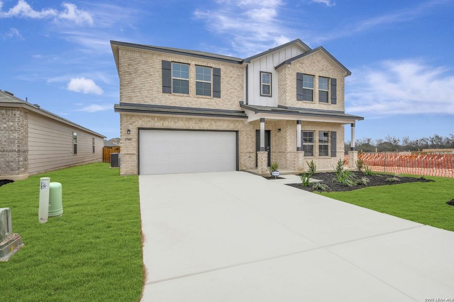 Front exterior of a new home in Winding Brook, San Antonio, TX, highlighting curb appeal (Image 26).