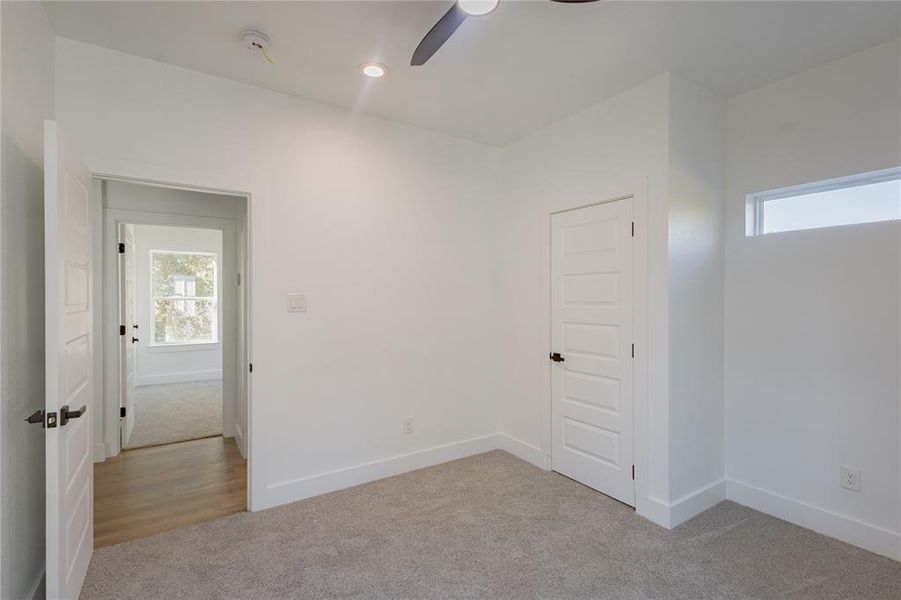2nd Bedroom featuring light colored carpet, recessed lighting, and ceiling fan 2nd Bedroom featuring light colored carpet, recessed lighting, and ceiling fan
