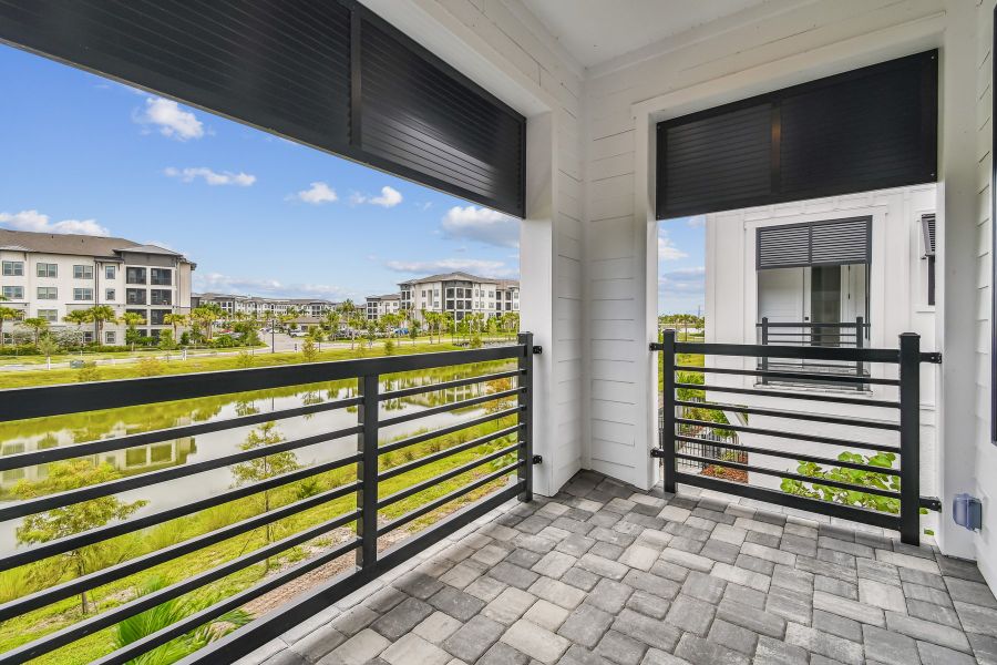 Exterior details and patio area of a home in Emerald Landing at Waterside at Lakewood Ranch – City Homes, Sarasota (Image 3).