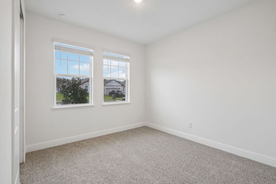 Spacious, unfurnished interior of a new home in Legends Preserve - Signature Series, Daytona Beach (Image 16).