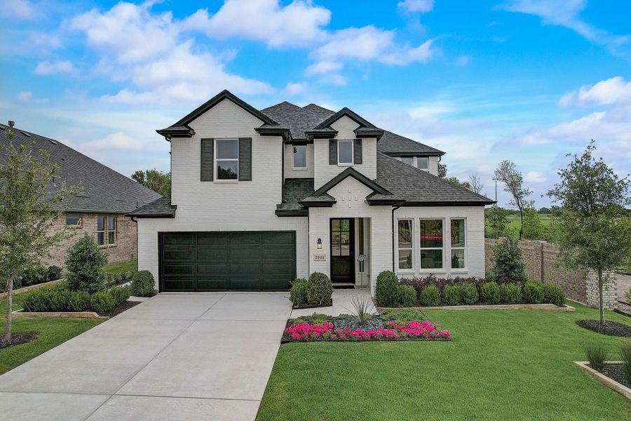 Front exterior of a new home in Cross Creek Meadows, Celina, TX, highlighting curb appeal (Image 2). Front exterior of a new home in Cross Creek Meadows, Celina, TX, highlighting curb appeal (Image 2).