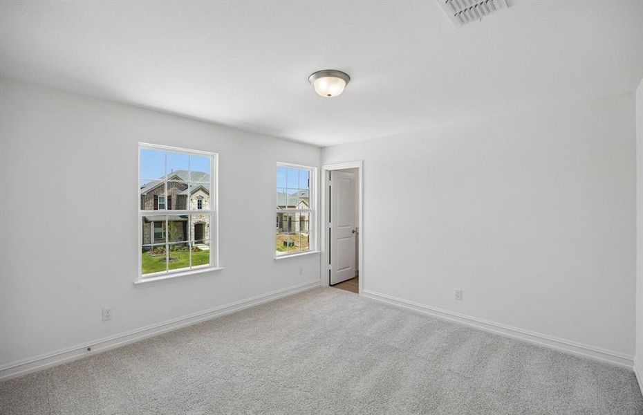 Secondary bedroom with large windows