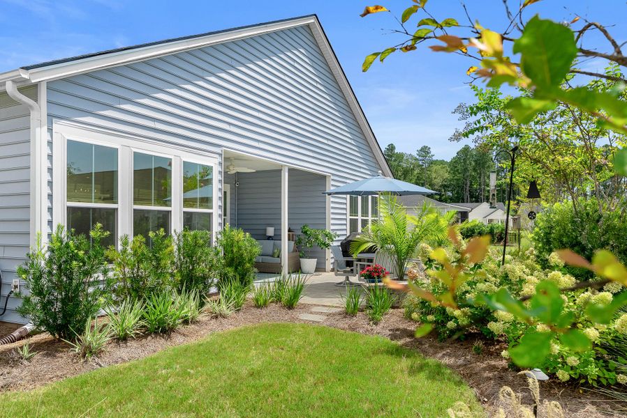 Front exterior of a new home in Horizons at Summers Corner | 55+: The Estates, Summerville, SC, highlighting curb appeal (Image 26).