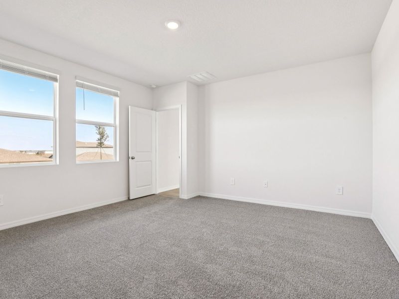 Spacious, unfurnished interior of a new home in The Grove at Stuart Crossing - Classic Series, Bartow (Image 15).