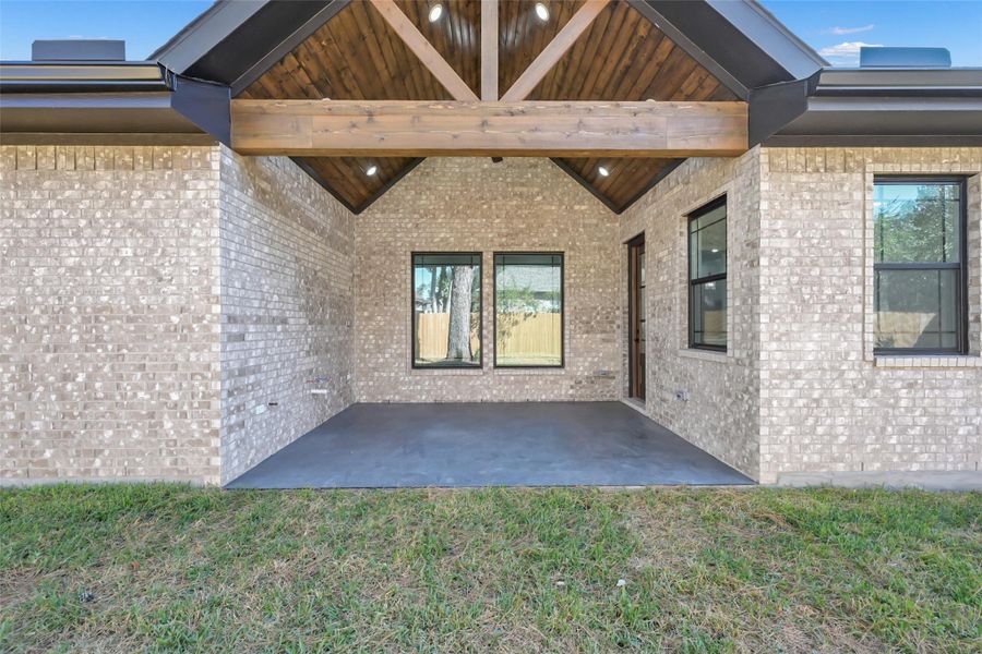 Spacious covered patio perfect for outdoor dining and entertaining Spacious covered patio perfect for outdoor dining and entertaining