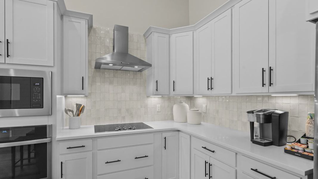 Stylish kitchen in the Summit home plan with quality finishes and functional design.