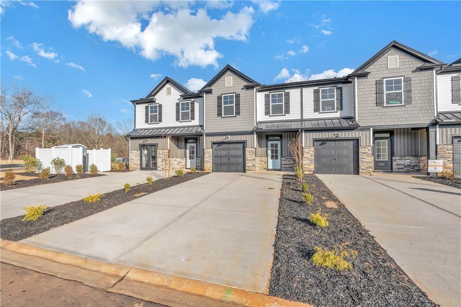 Front exterior of a new home in Meece Townhomes, Easley, SC, highlighting curb appeal (Image 18).