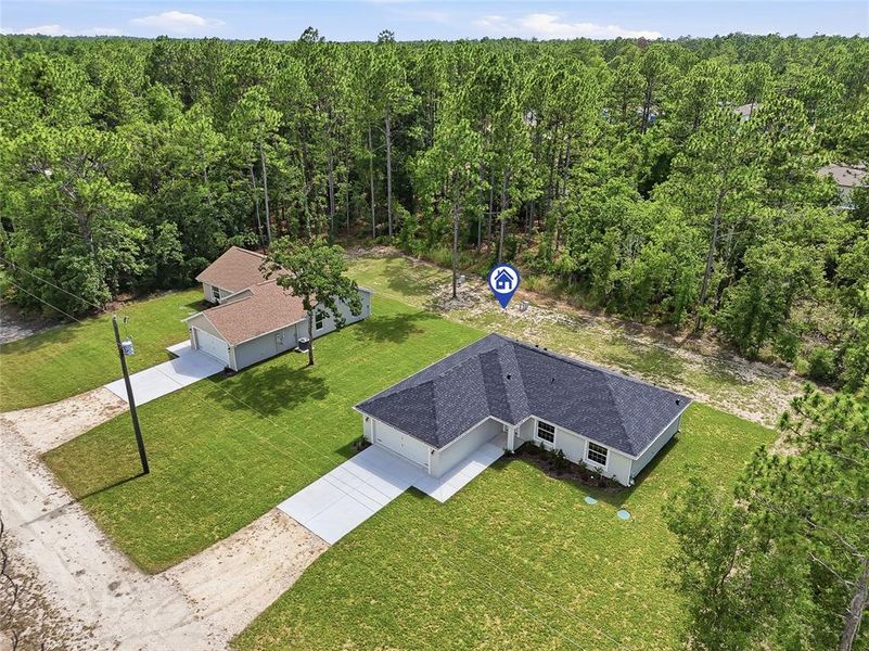 Front exterior of a new home in , Weeki Wachee, FL, highlighting curb appeal (Image 28). Front exterior of a new home in , Weeki Wachee, FL, highlighting curb appeal (Image 28).