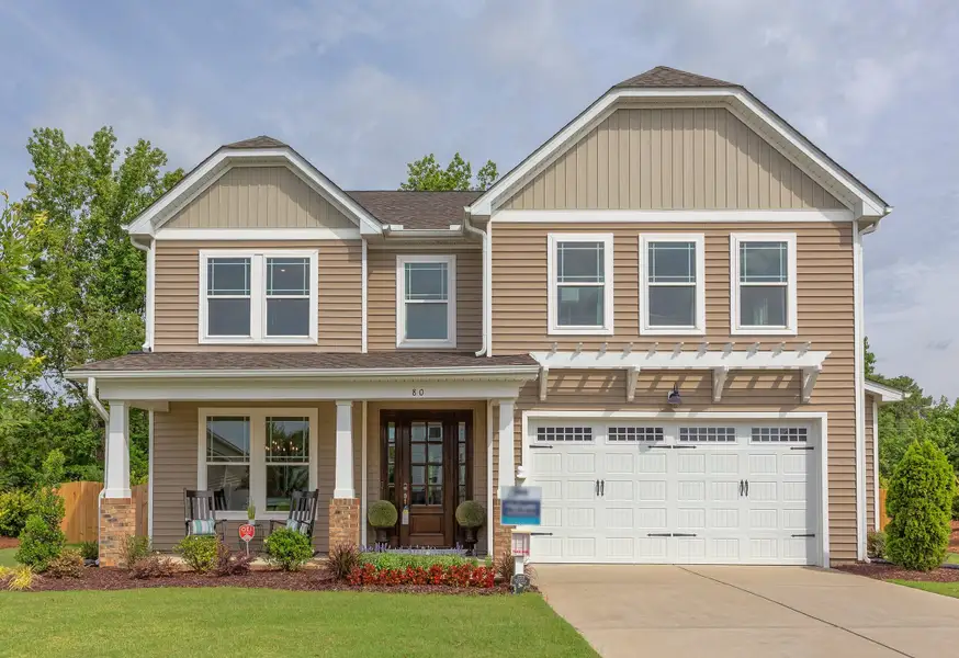 Front exterior of a new home in Highgate, Clayton, NC, highlighting curb appeal (Image 1). Front exterior of a new home in Highgate, Clayton, NC, highlighting curb appeal (Image 1).