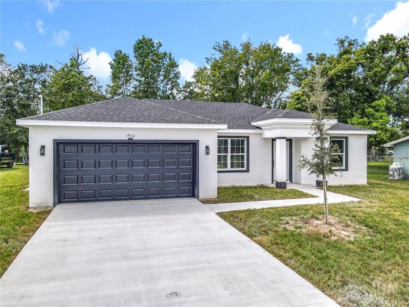 Front exterior of a new home in , Deland, FL, highlighting curb appeal (Image 21).