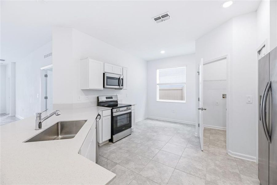 Furnished interior view inside a new home in Peace Creek Reserve, Winter Haven (Image 8).
