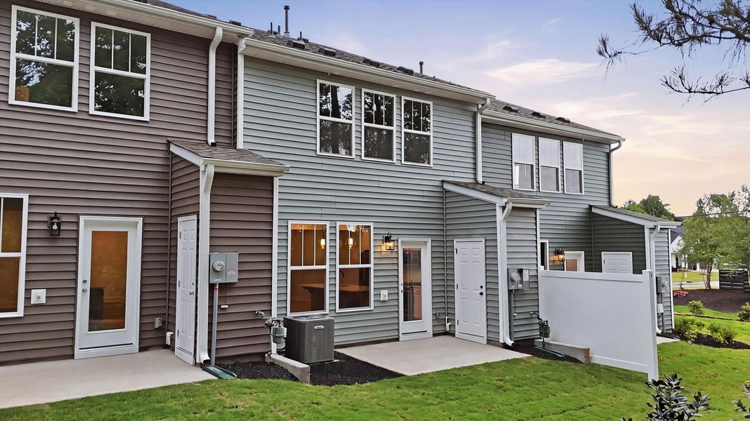 Elegant exterior with a rear patio—perfect for relaxing or entertaining outdoors located at the new Anna's Pointe community