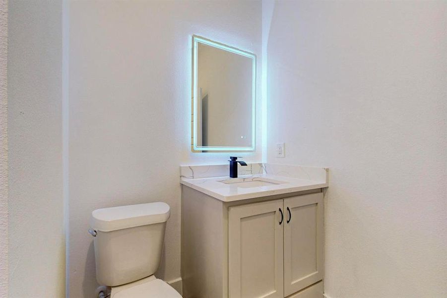 Bathroom with vanity and toilet