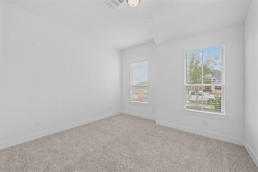 Representative unfurnished interior of a home built from the Madison by Chesmar Homes in Grange, Katy (Image 27).