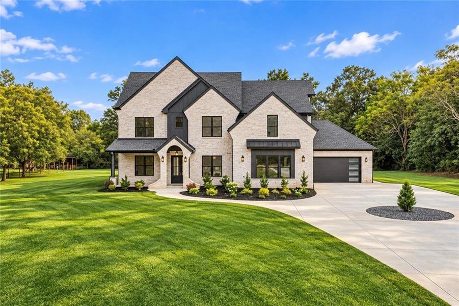 Front exterior of a new home in , Monroe, GA, highlighting curb appeal (Image 31).