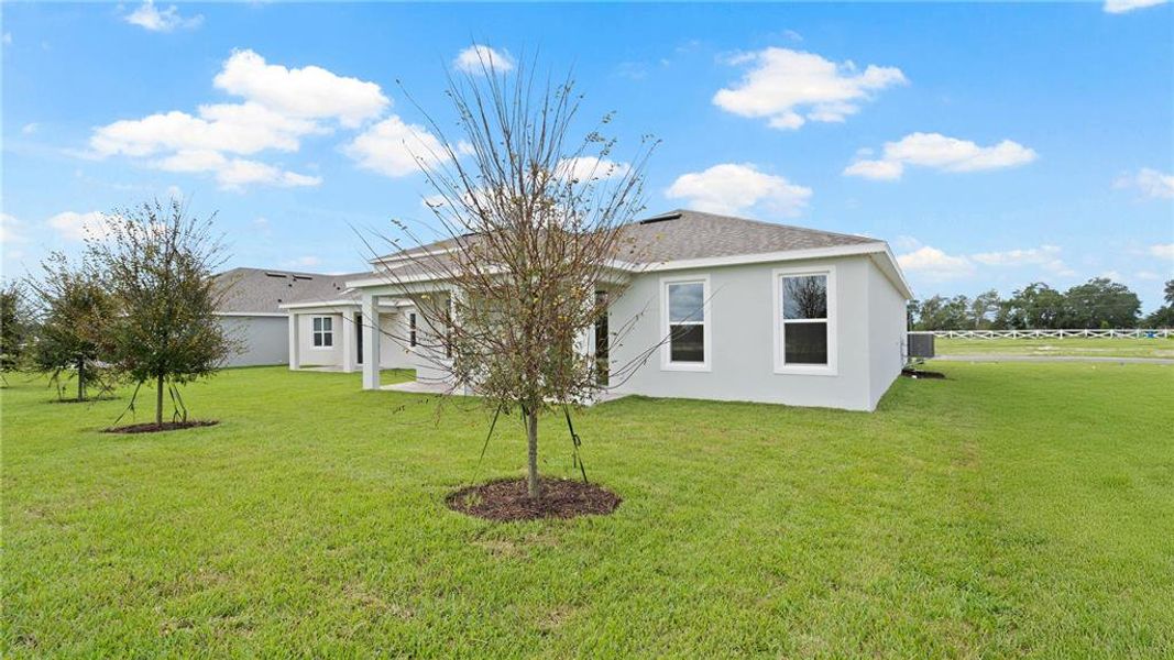 Front exterior of a new home in Trailside, Mount Dora, FL, highlighting curb appeal (Image 19).