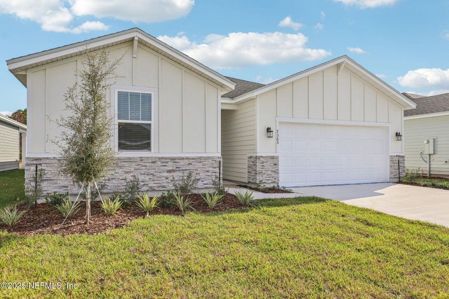 Front exterior of a new home in Cypress Meadows - Signature Series, Jacksonville, FL, highlighting curb appeal (Image 2).