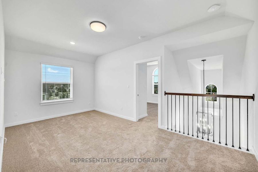 Carpeted spare room featuring healthy amount of natural light and recessed lighting Carpeted spare room featuring healthy amount of natural light and recessed lighting