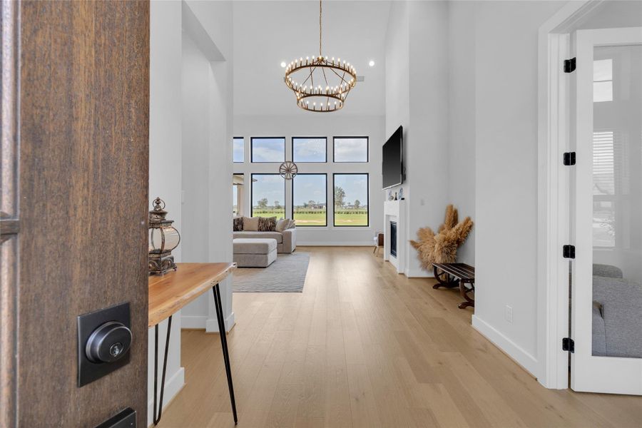 Grand foyer with soaring ceilings and abundant natural light.
